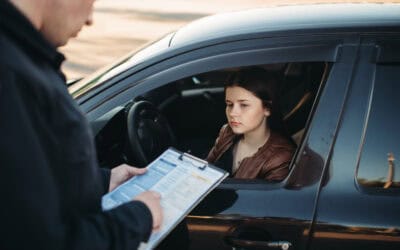 Policeman in uniform writes fine to female driver