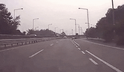 Car dodging at speed on highway