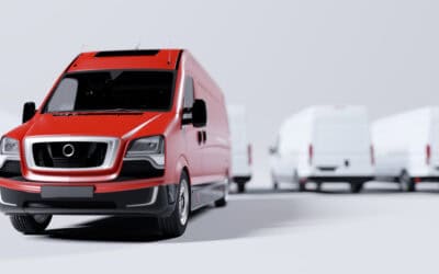 Red commercial van and fleet of white trucks. Transport. Transport and shipping