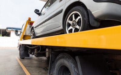 Broken car being towed